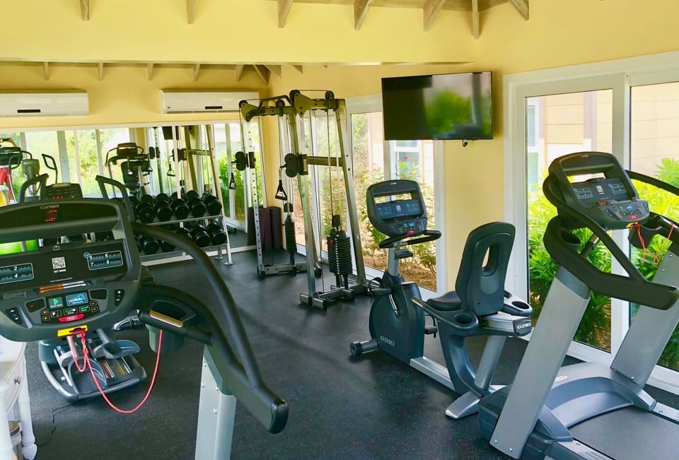 Air conditioned gym, free weights and aerobic machines