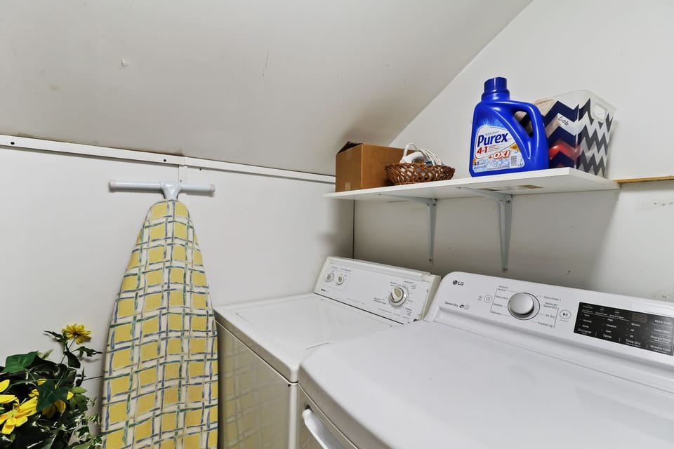 Full sized washer and dryer in the upstairs laundry area. Full sized iron board