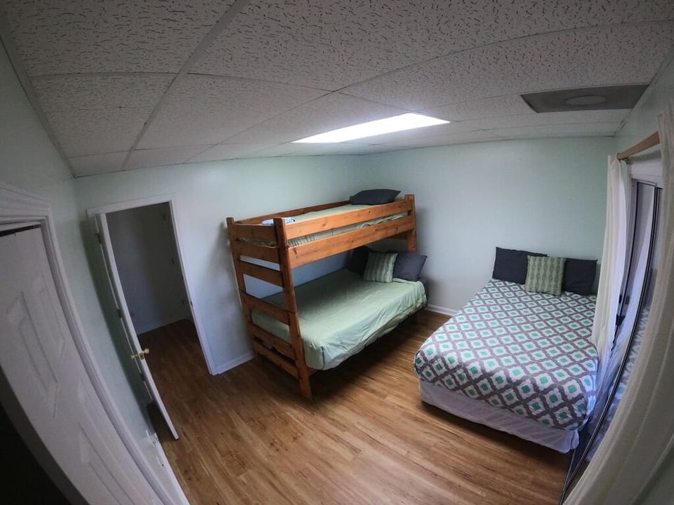 Bedroom 3 downstairs with two fulls and a twin.