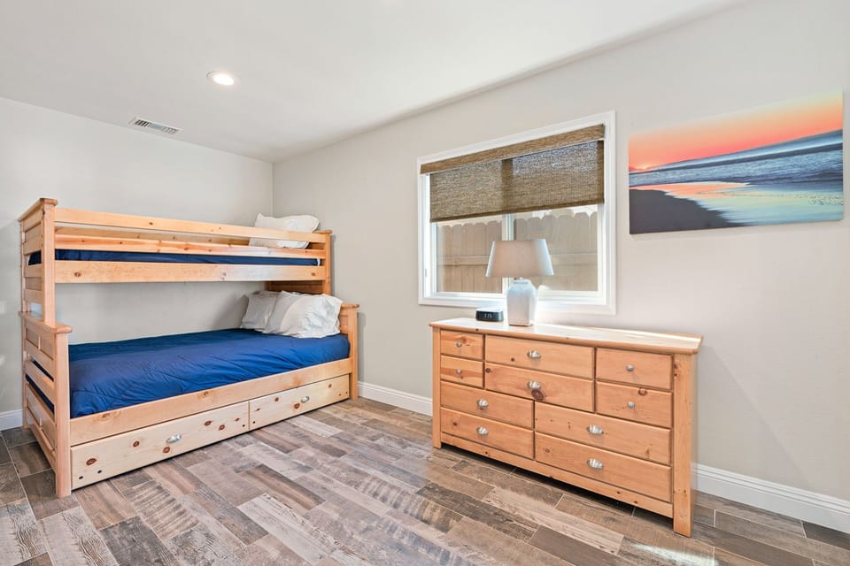 The second bedroom's bunk bed features a twin mattress on top, a full size mattress on bottom, and a twin trundle bed that pulls out from underneath the bunk bed.
                