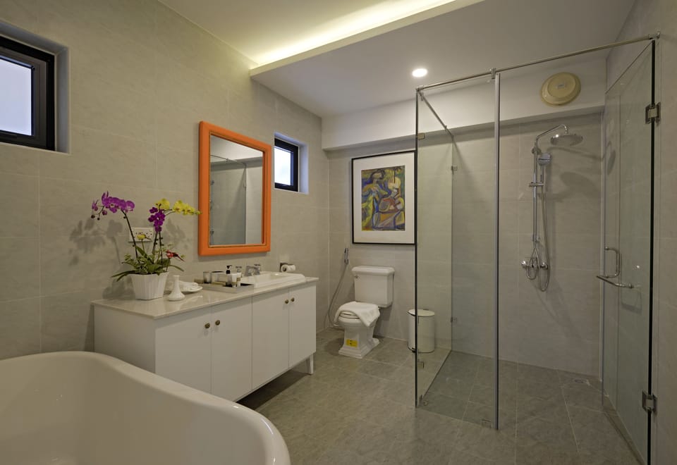 Deluxe Quadruple Room | Bathroom | Separate tub and shower, deep soaking tub, rainfall showerhead