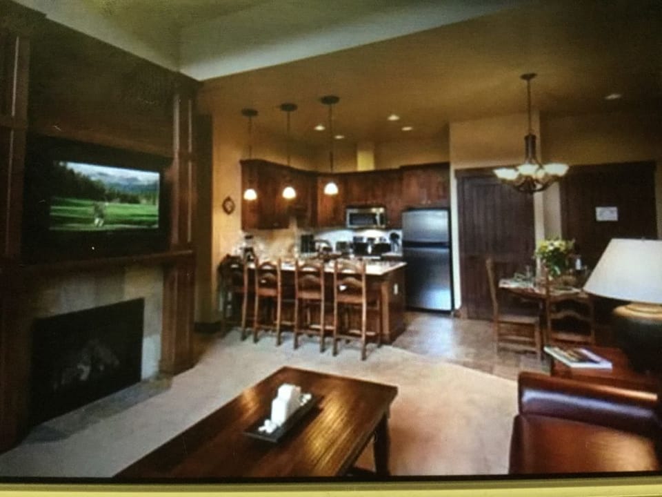 View of the kitchen and dining area from deck door