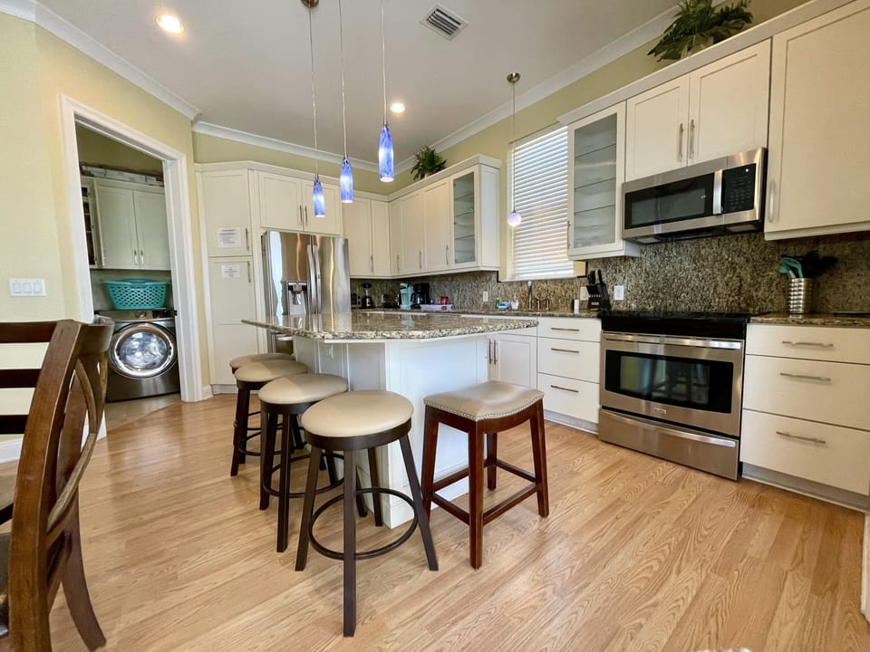 Upscale stainless steel appliances, with a well-stocked kitchen for foodies.