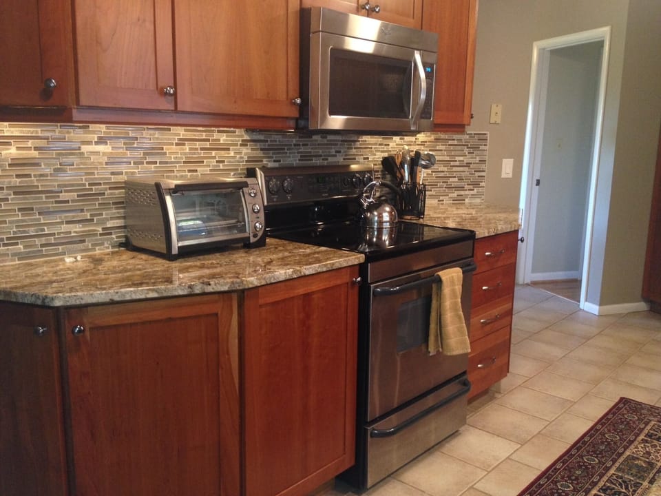 FULLY equipped, gourmet kitchen. Opens to patio with dining table and gas grill.