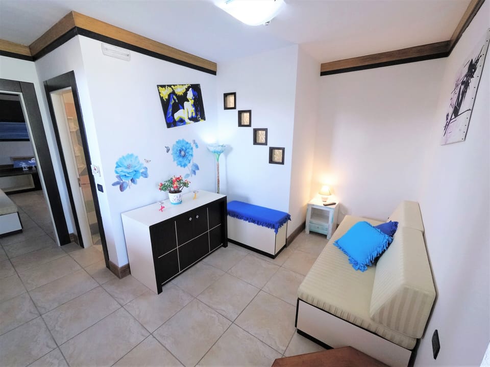 Panoramic Suite, Sea View, Sea Facing | Living area | TV