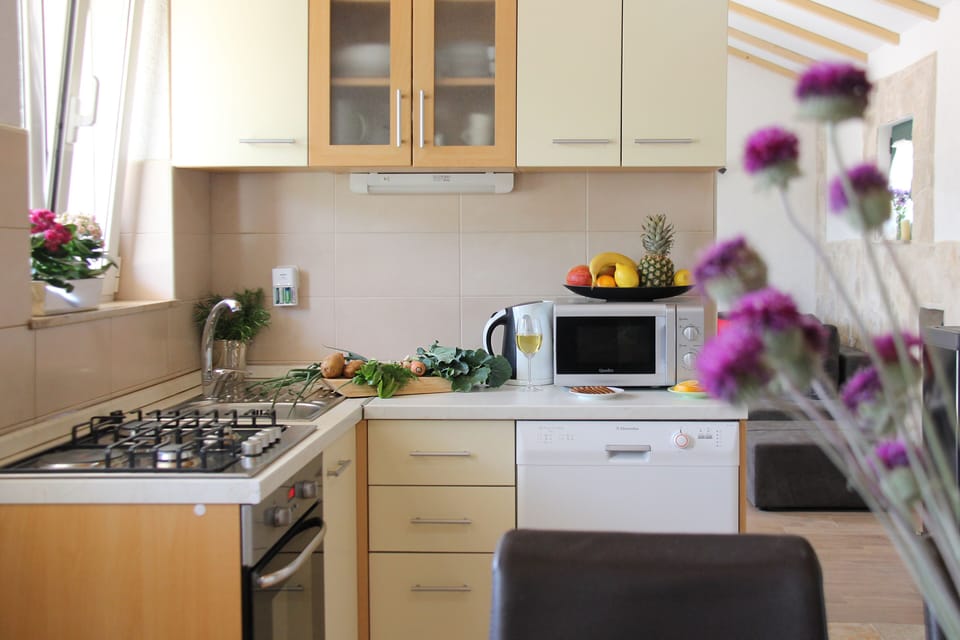 Fully equipped kitchen with all appliances 

