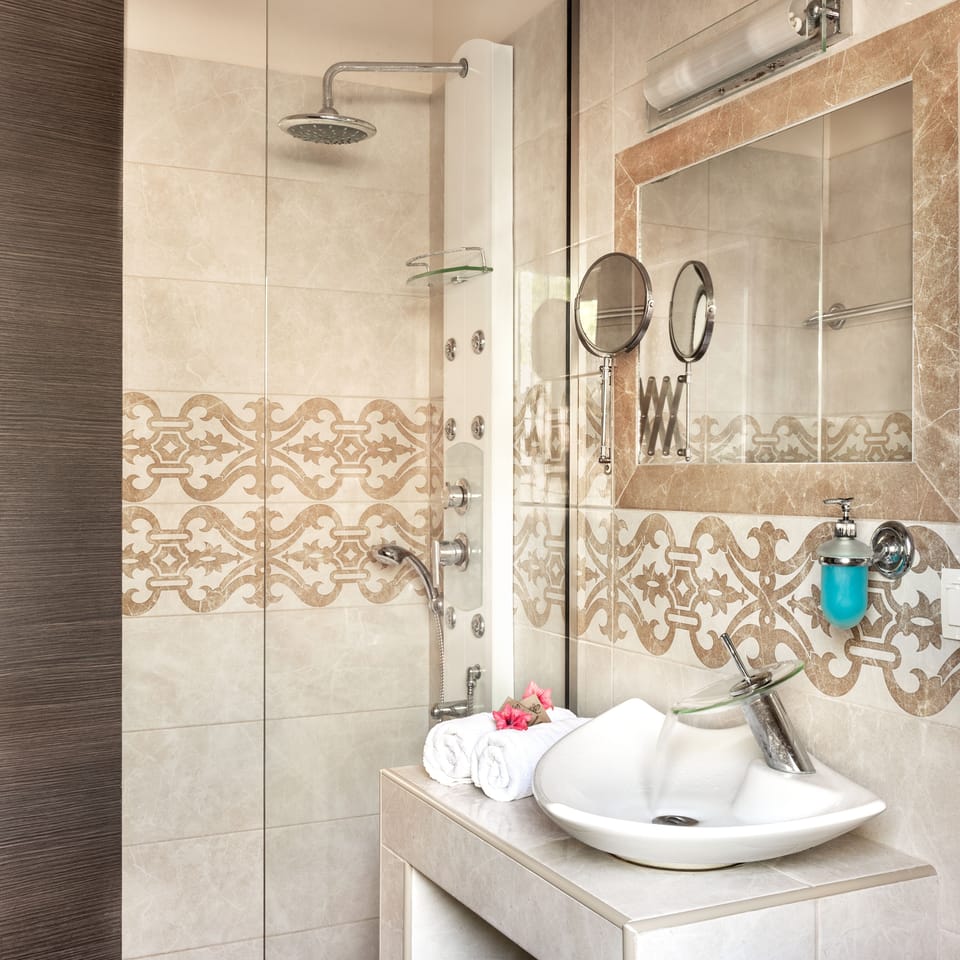 Shower, rainfall showerhead, hair dryer, towels