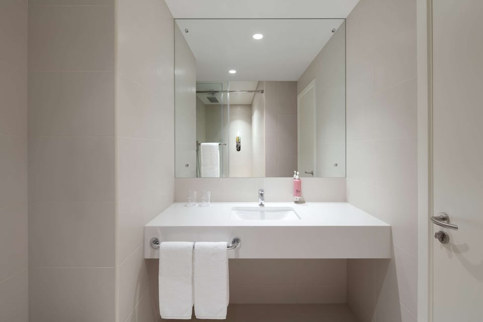 Shower, rainfall showerhead, hair dryer, towels
