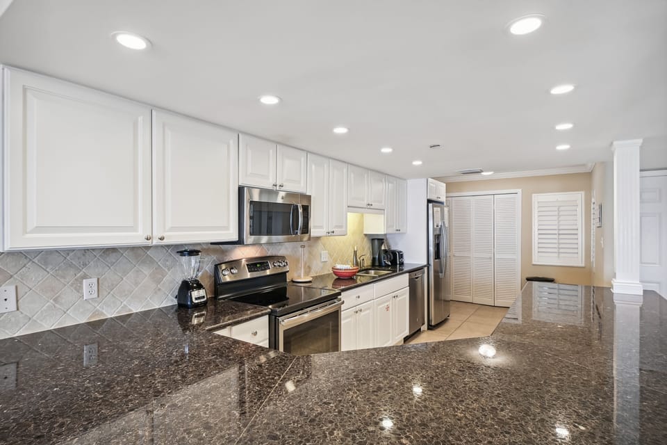 Condo, 2 Bedrooms | Private kitchen | Fridge, microwave, oven, dishwasher