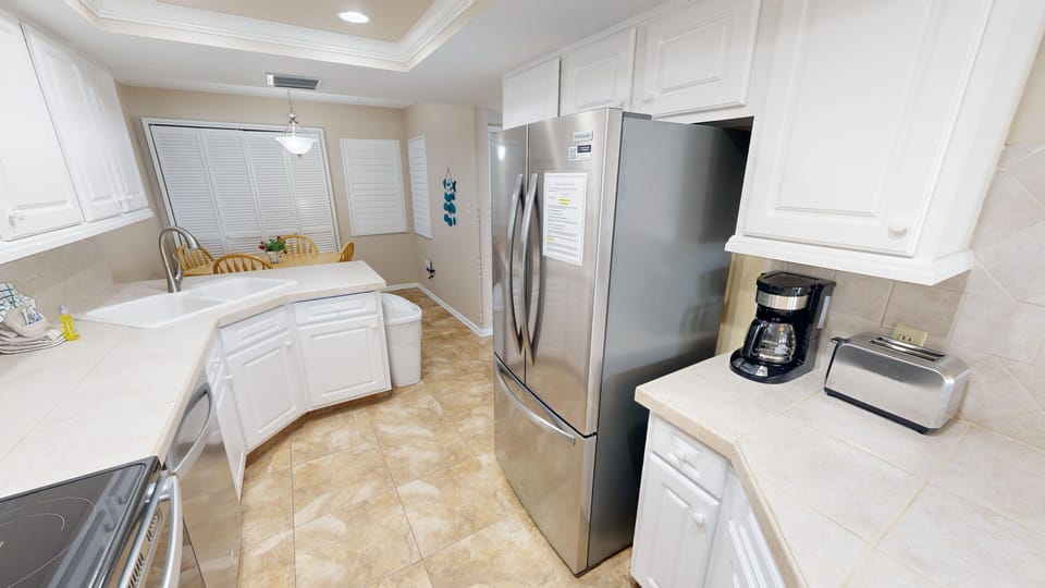 Condo, 2 Bedrooms | Private kitchen | Fridge, microwave, oven, dishwasher