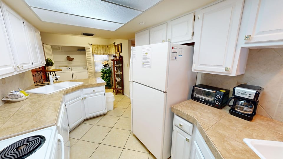 Condo, 2 Bedrooms | Private kitchen | Fridge, microwave, oven, dishwasher