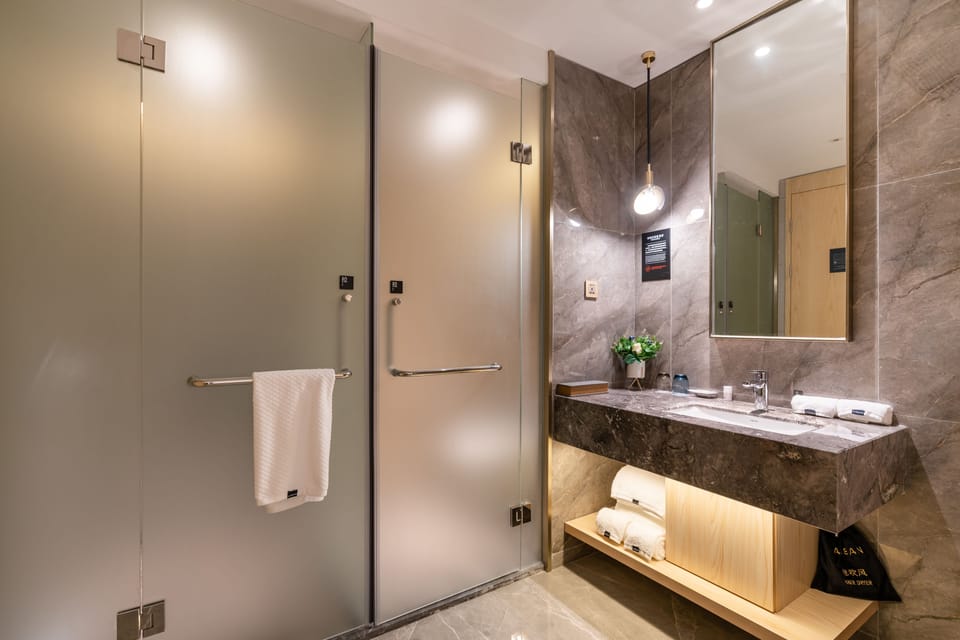 Shower, eco-friendly toiletries, hair dryer, slippers