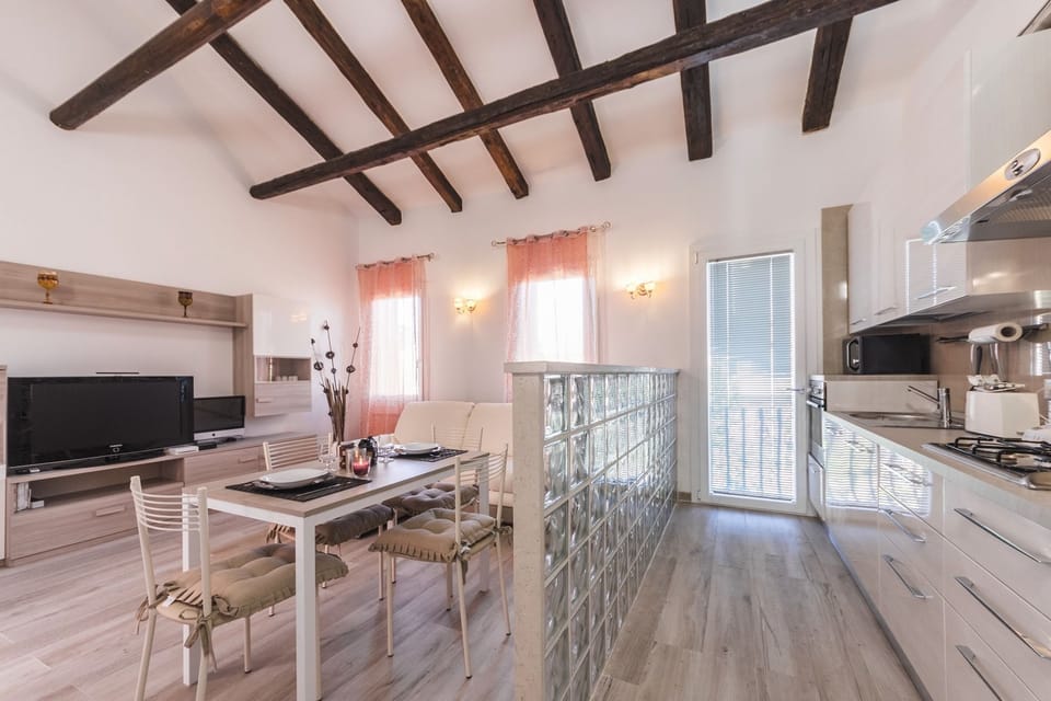 Deluxe Apartment, Multiple Beds, Non Smoking, Canal View | Living area | 40-inch flat-screen TV with digital channels, TV