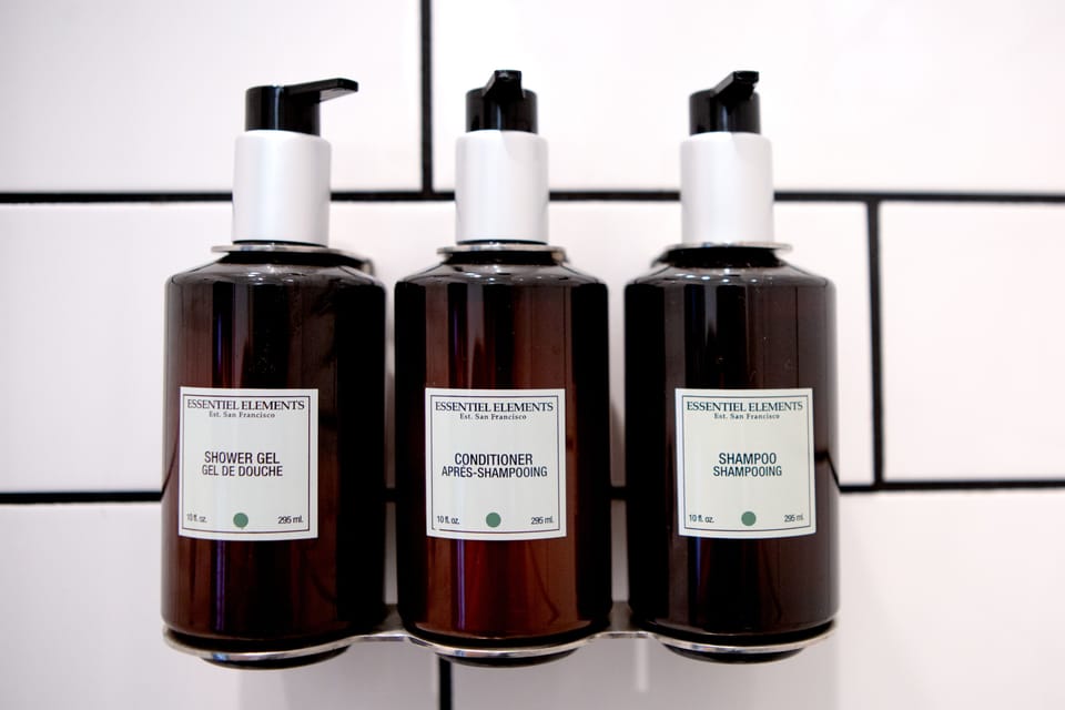 Shower, designer toiletries, towels