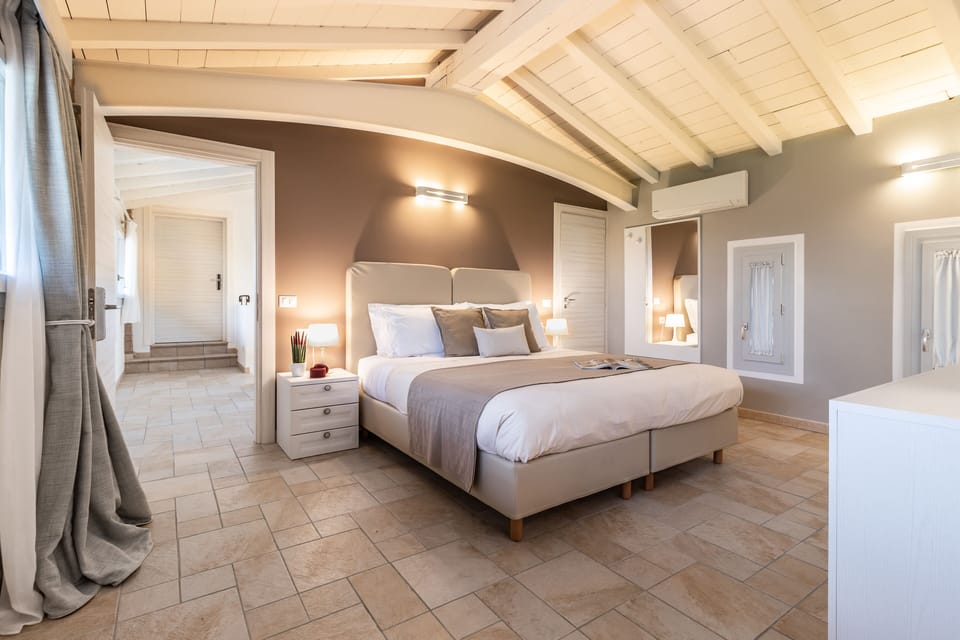 Apartment, 1 Bedroom, Park View (Mantova) | Minibar, in-room safe, individually decorated, desk