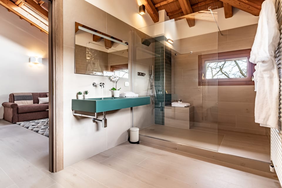 Suite, Pool View (Venezia) | Bathroom | Shower, rainfall showerhead, free toiletries, hair dryer