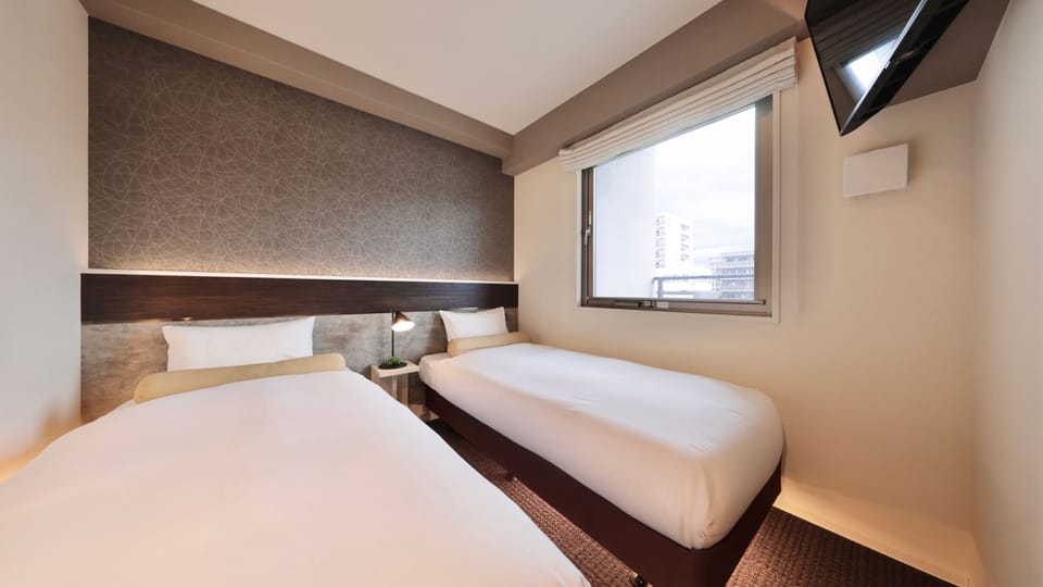 Standard Twin Room | Blackout drapes, iron/ironing board, free WiFi, bed sheets