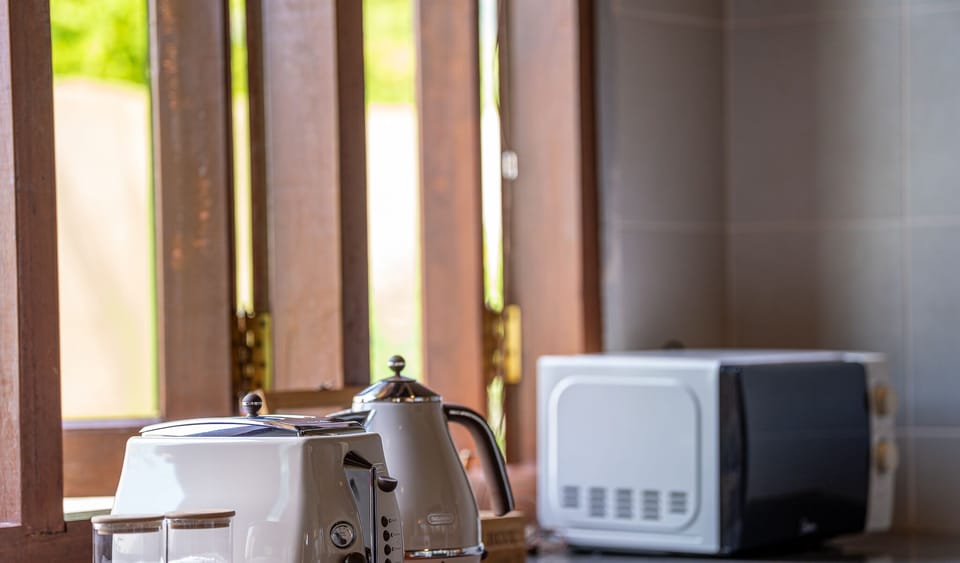 Villa, 4 Bedrooms | Private kitchen | Fridge, microwave, coffee/tea maker, electric kettle