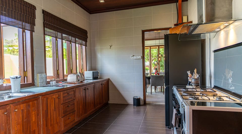 Villa, 4 Bedrooms | Private kitchen | Fridge, microwave, coffee/tea maker, electric kettle