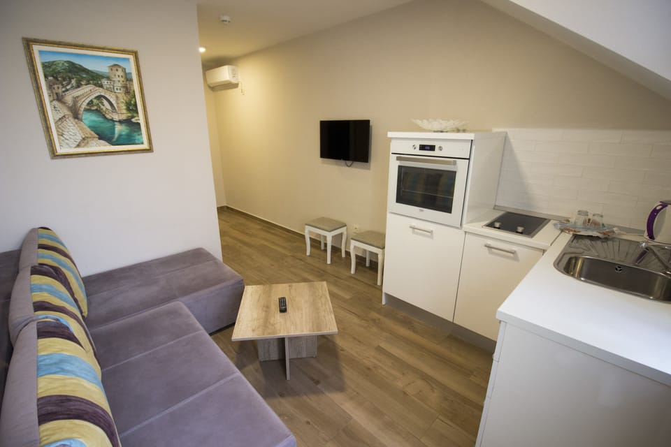 Apartment | Living area | TV, toys, books, heated floors