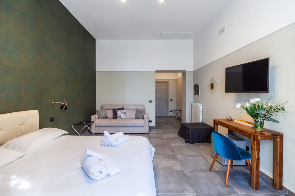 Deluxe Suite, 1 Bedroom | Premium bedding, down comforters, in-room safe, individually decorated