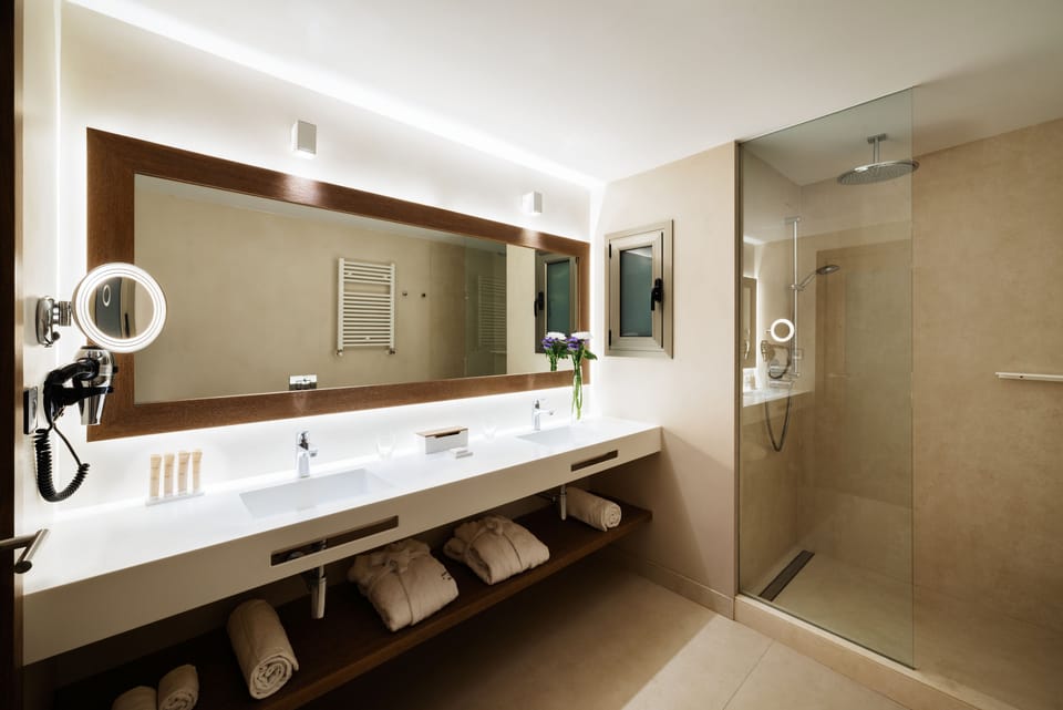 Eco-friendly toiletries, hair dryer, bathrobes, slippers