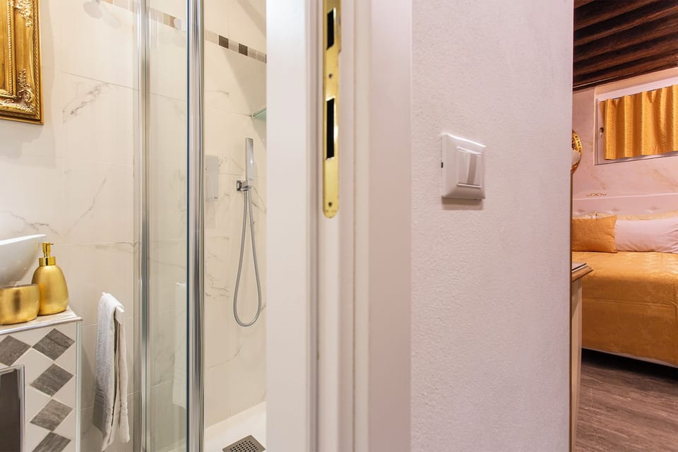 Small Room | Bathroom | Shower, free toiletries, hair dryer, slippers