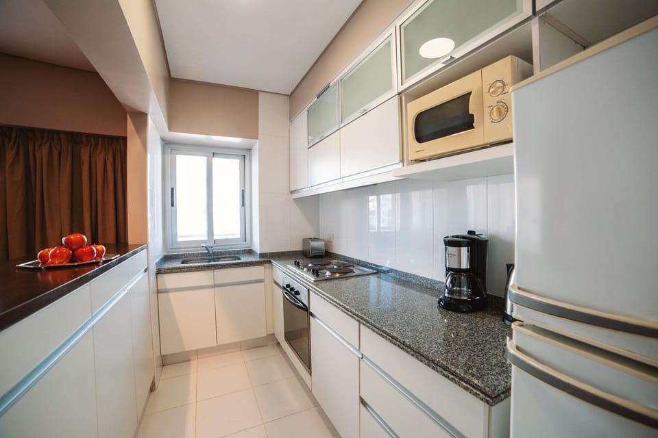 Senior Suite | Private kitchen | Microwave, stovetop, coffee/tea maker, electric kettle