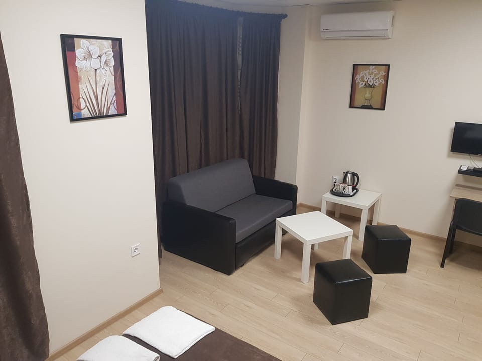 Superior Room | Living area | 24-inch LCD TV with cable channels, TV