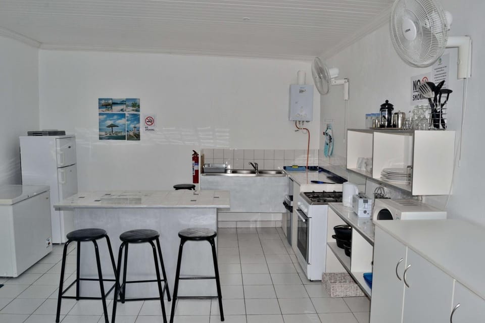 Fridge, stovetop, electric kettle, cookware/dishes/utensils