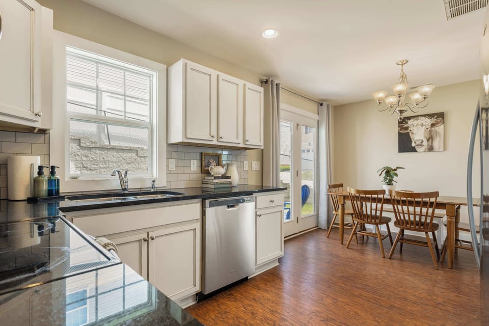 "Kitchen was equipped with everything needed to cook and everything felt like home." Past guest. Granite counters, stainless appliances, and a table for six.