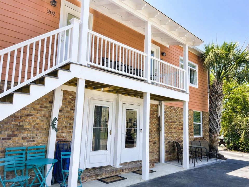 #102 is the bottom left unit in this photo.  Located in the rear of the complex - steps away from the coffee shop next door!