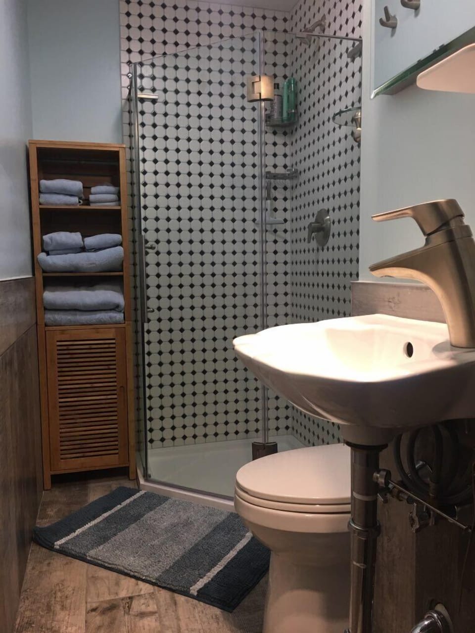 Awesome shower w/Glass Door and plenty of storage in Bathroom