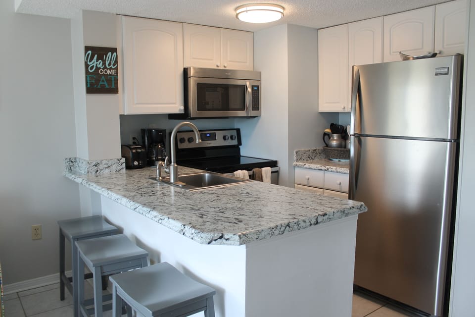 Beautiful new kitchen updates include new counter tops and appliances. 