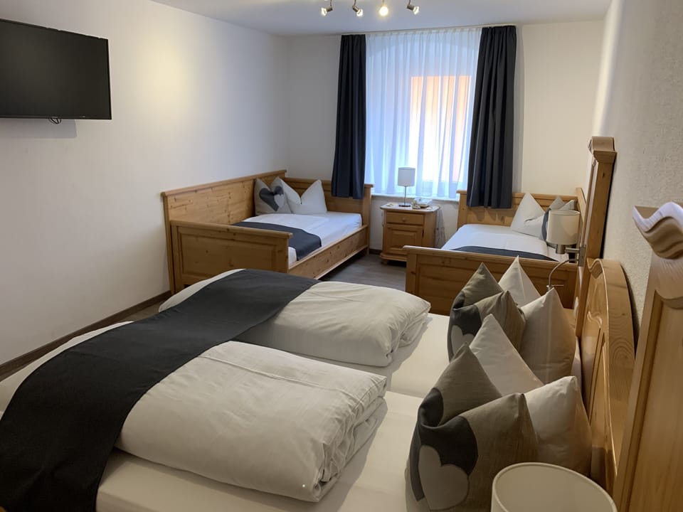 Standard Quadruple Room | Premium bedding, memory foam beds, desk, laptop workspace