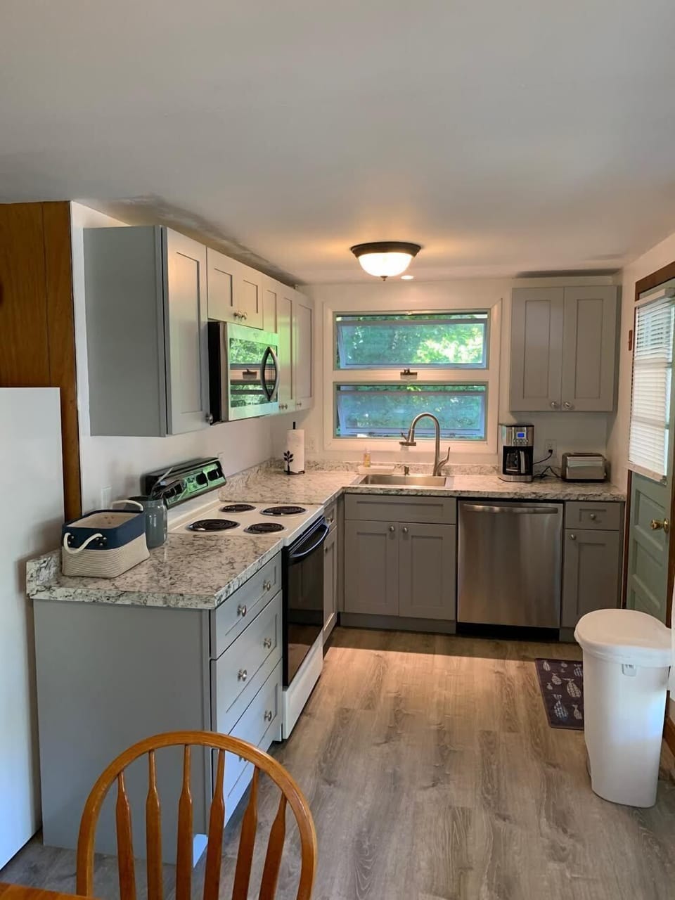 Newly updated kitchen w/ stainless microwave, dishwasher, fridge (not pictured)