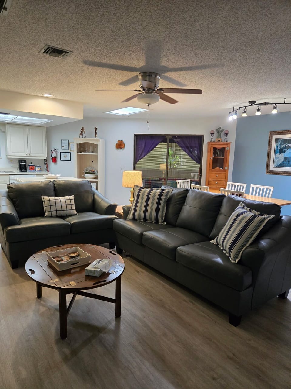 Living room with new leather sofa and love seat.
