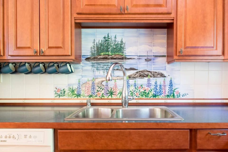 Hand painted tiles behind the kitchen sink.