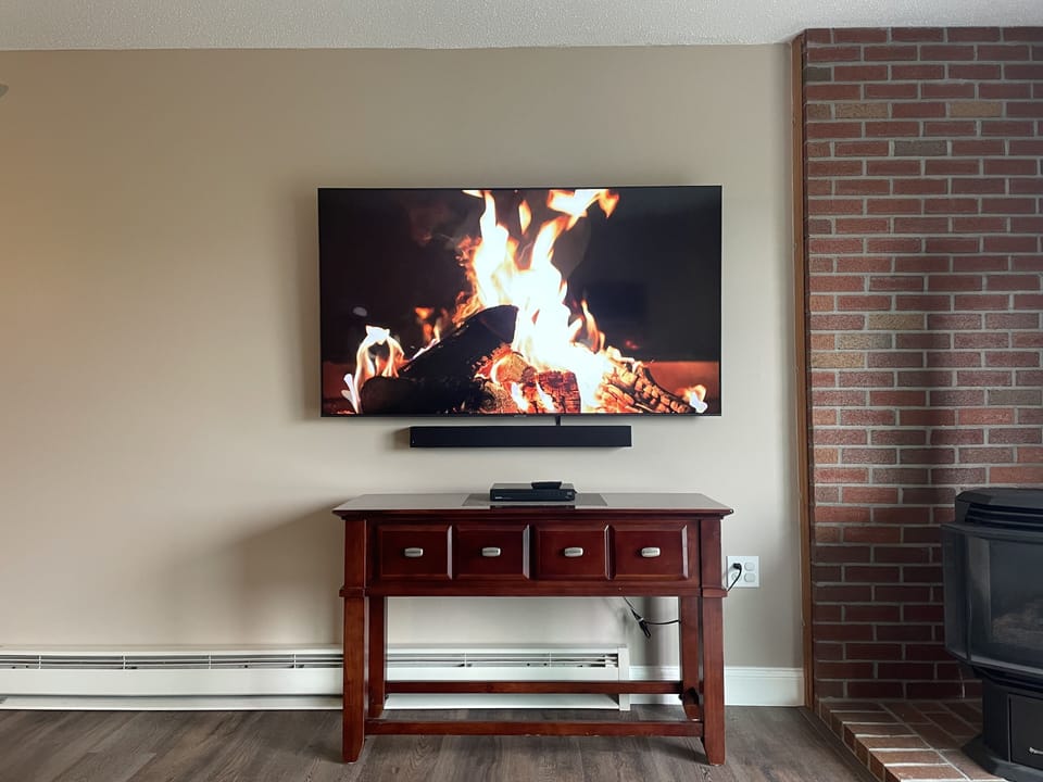 75" smart TV with surround sound system. 