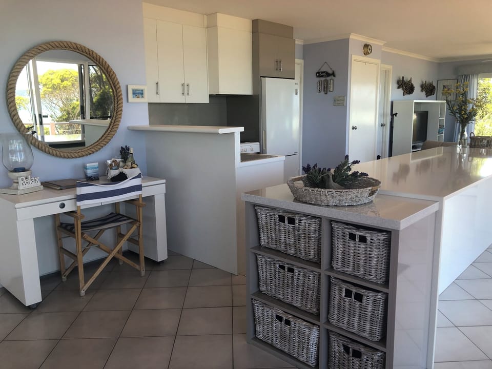 Writers desk & kitchen with lots of storage baskets
