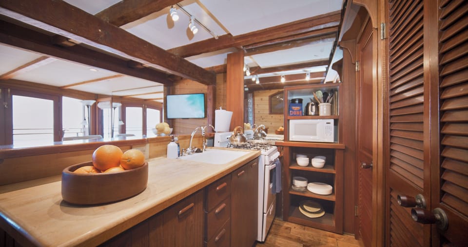 Kitchen counter space with stove and microwave