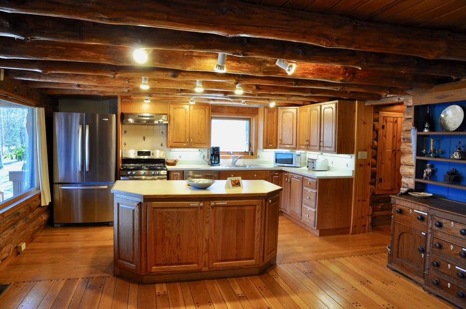 Kitchen with hallway off to TV room, bedroom and private full bath