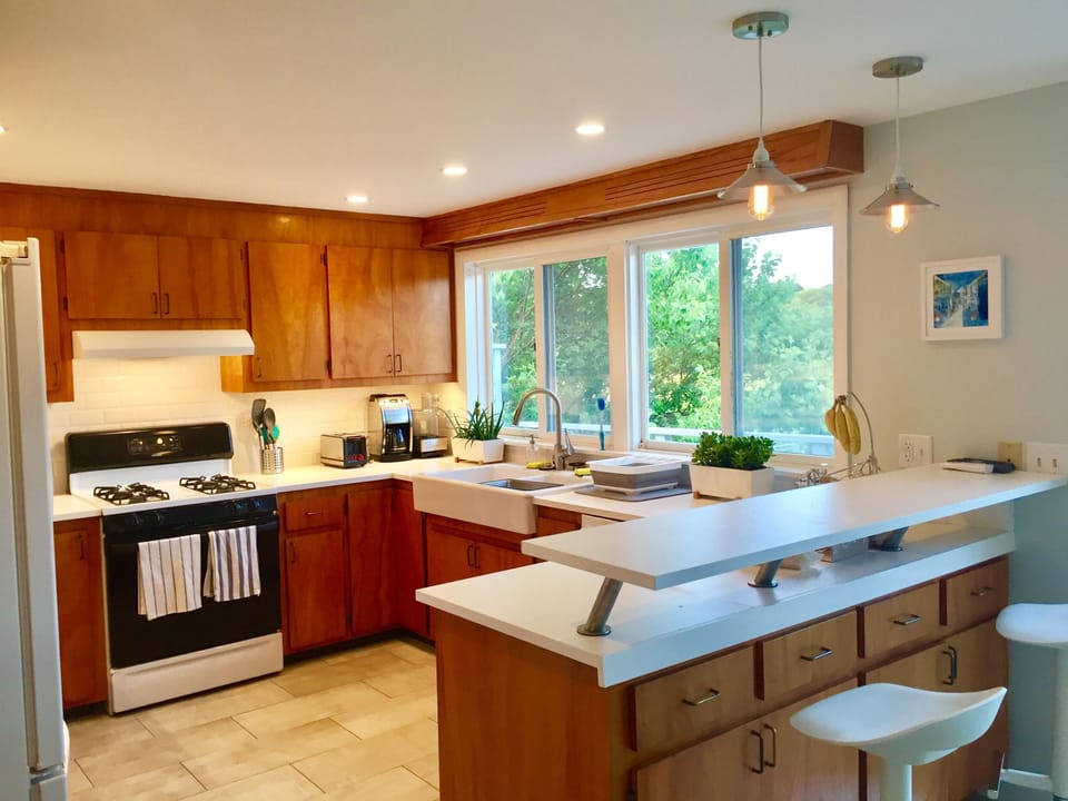 The kitchen includes new appliances, & is fully stocked w/ cooking utensils, etc