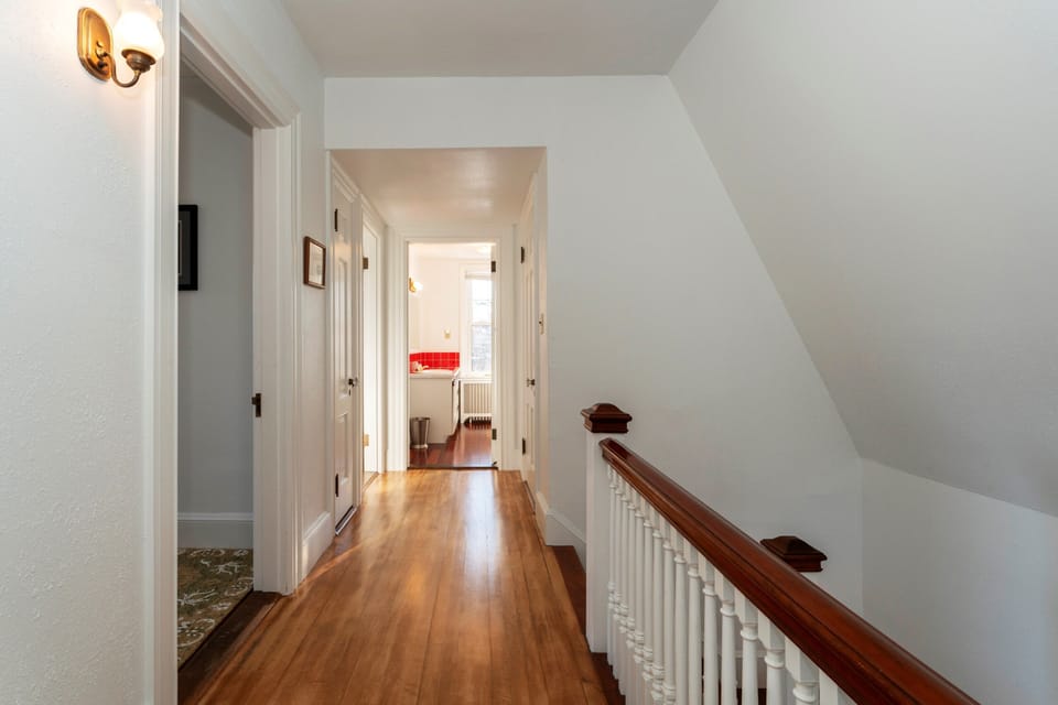 Upstairs hallway with stairs and bathroom