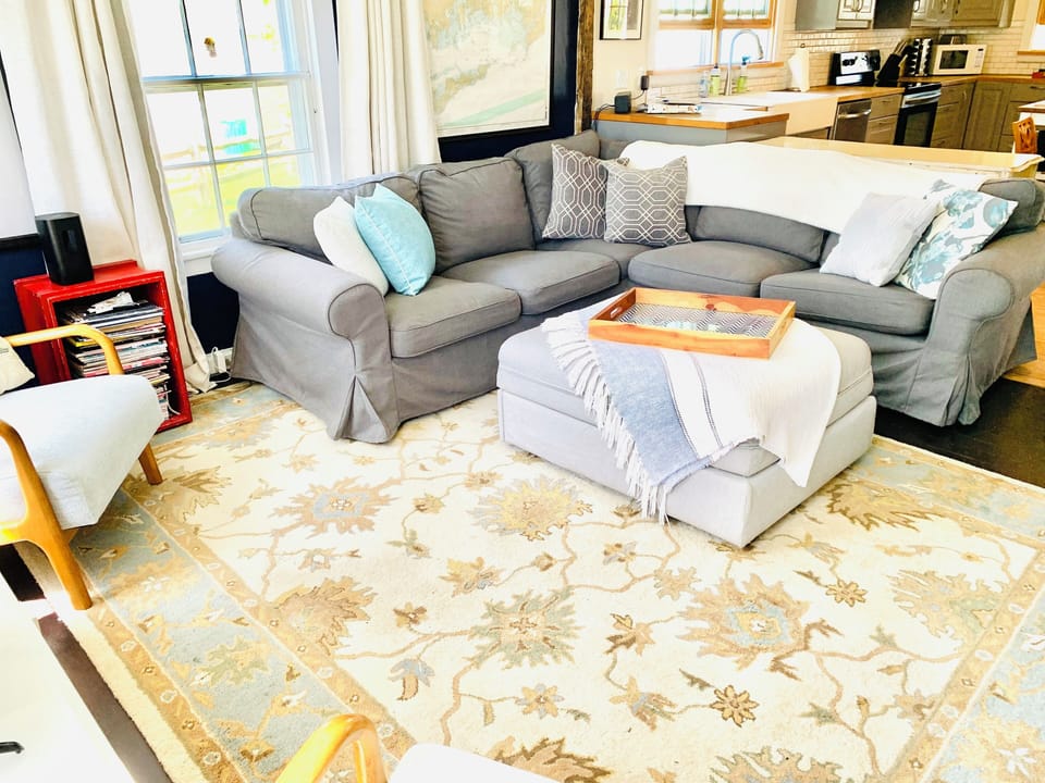 Our home sleeps 7 comfortably in beds, 8th guest: on this pull-out ottoman.
