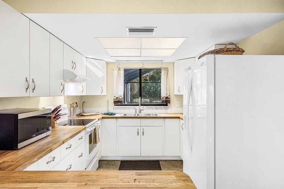 Beautiful chopping block counter tops in this small but mighty kitchen