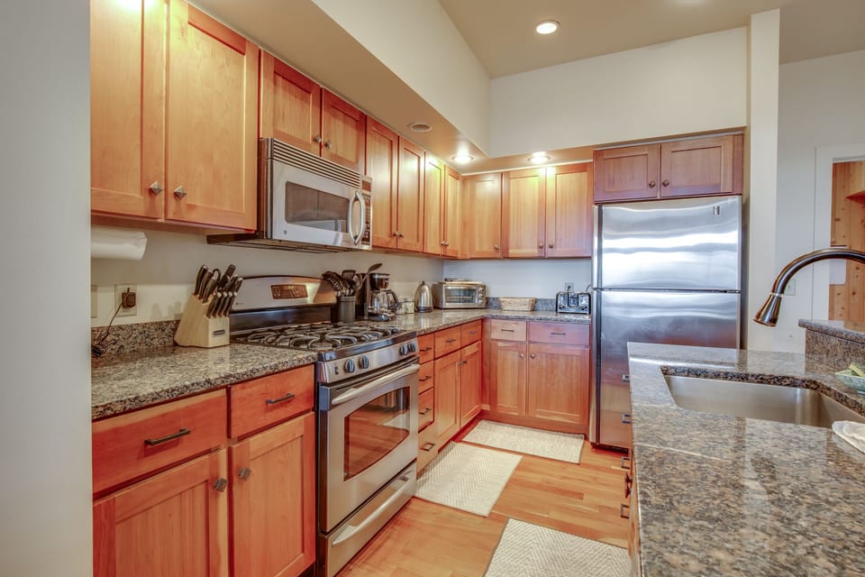 well-stocked kitchen with stainless appliances