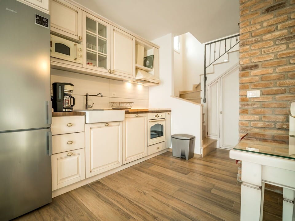 Room, Furniture, Property, Kitchen, Countertop, Cabinetry, Floor, Interior Design, Building, Yellow
