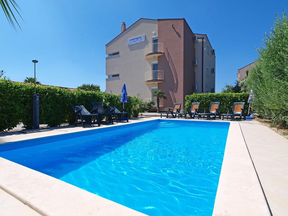 Water, Plant, Sky, Property, Daytime, Swimming Pool, Building, Blue, Azure, Shade