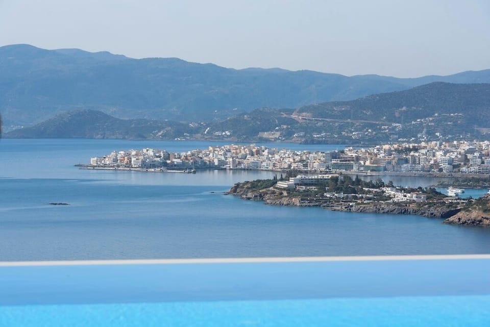 Magical Views. The pretty marina town of Agios Nikolaus from the pool & terrace